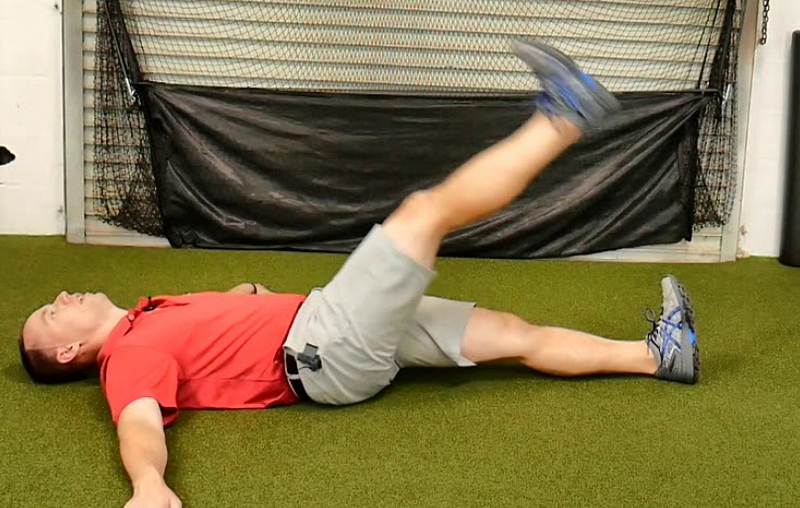 Supine leg swings for groin warm-up