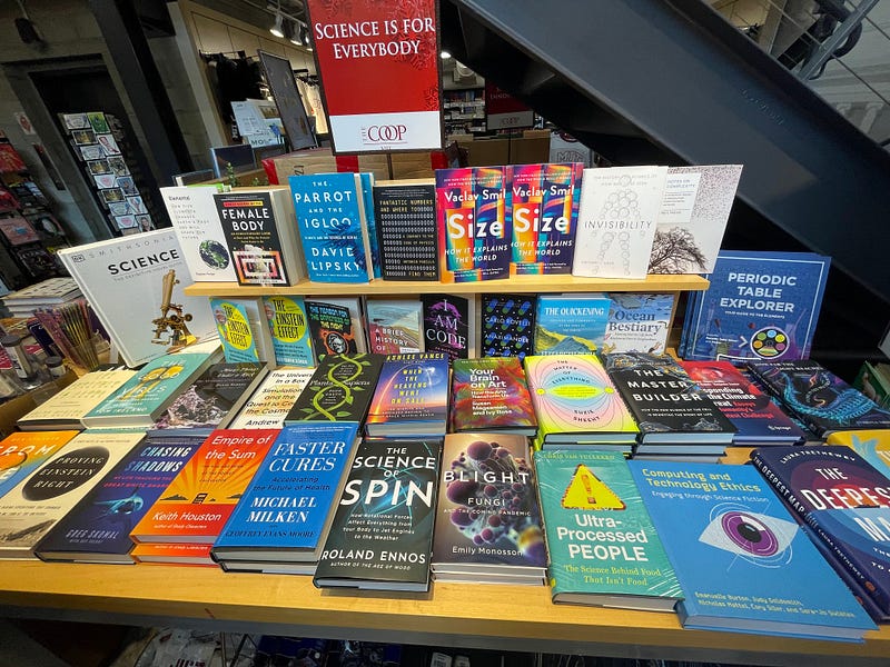 Bookshelf filled with diverse titles at MIT