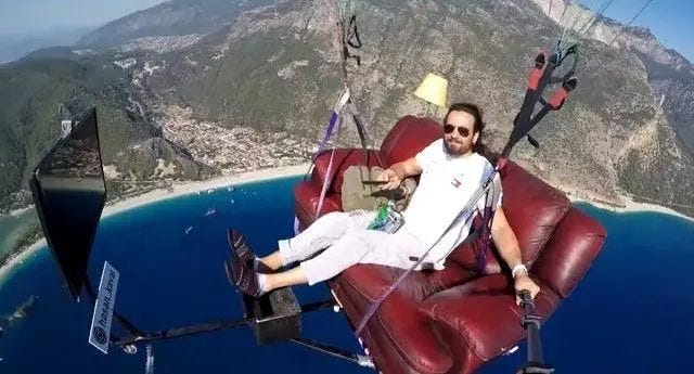 Paraglider featuring a sofa and TV setup