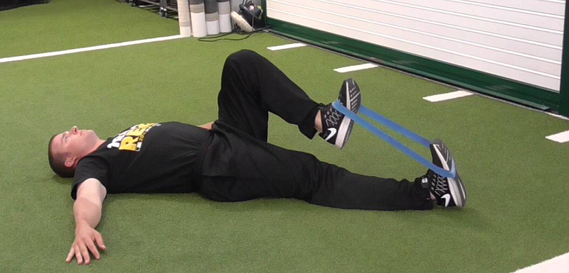 Performing a lying psoas march for hip strength